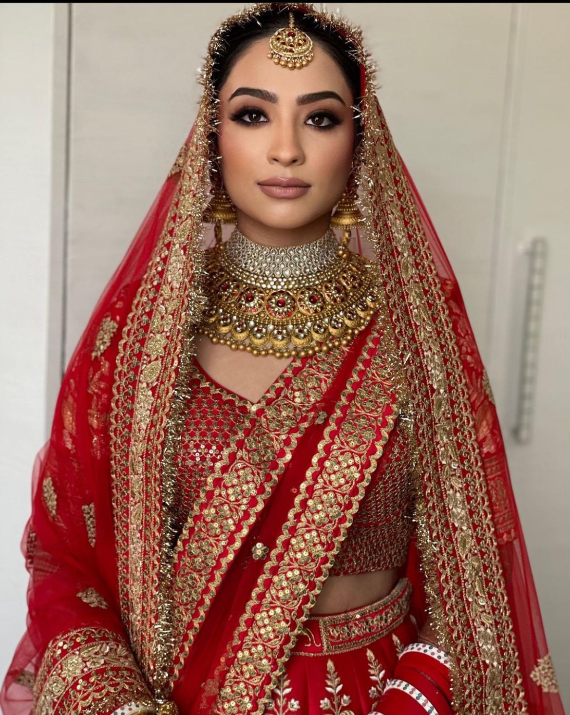 Sabyasachi Bride Teamed Her Red Gota Patti Gold Embroidered Lehenga With A Double Dupatta